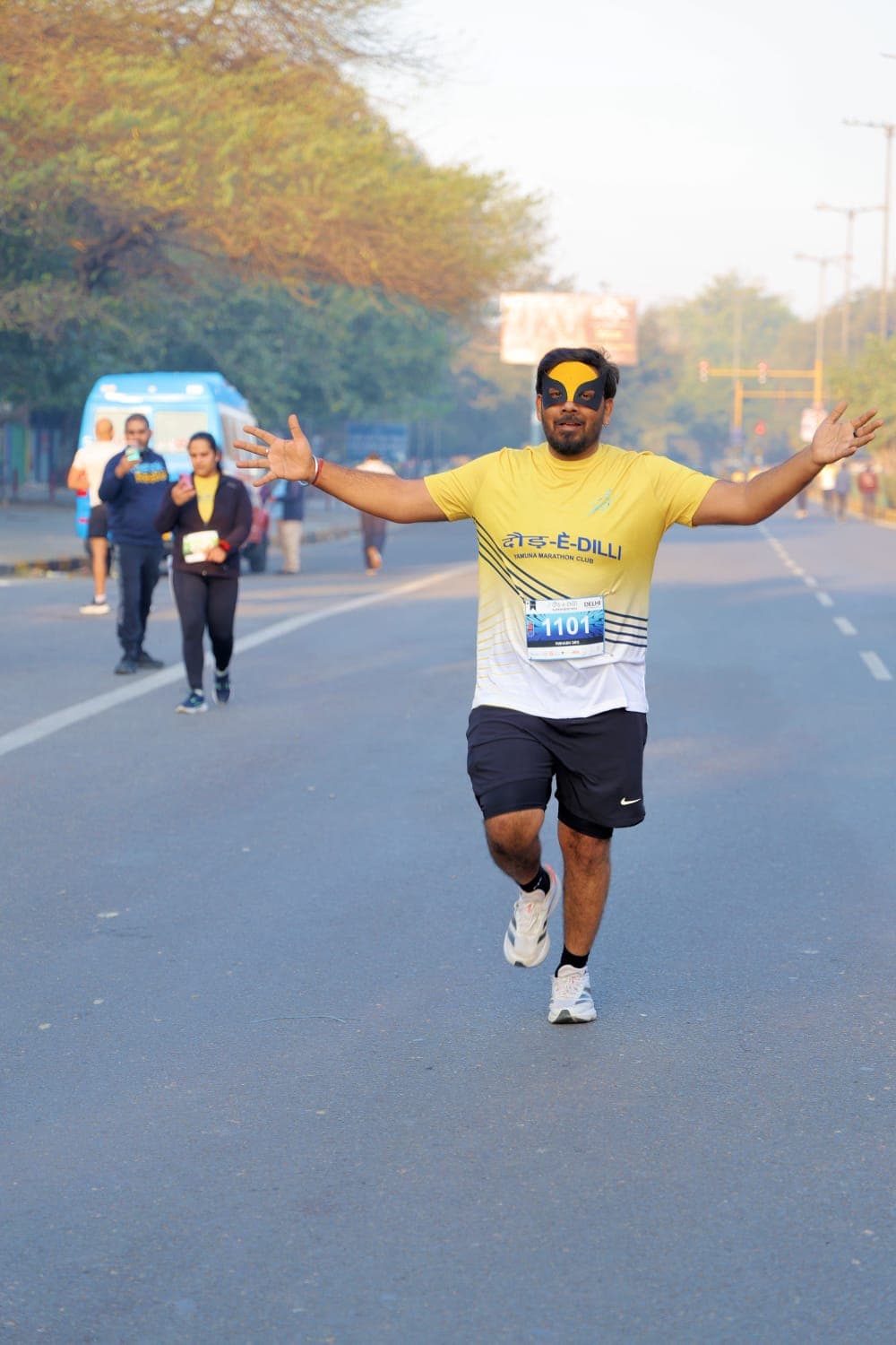 A runner celebrating mid-race
